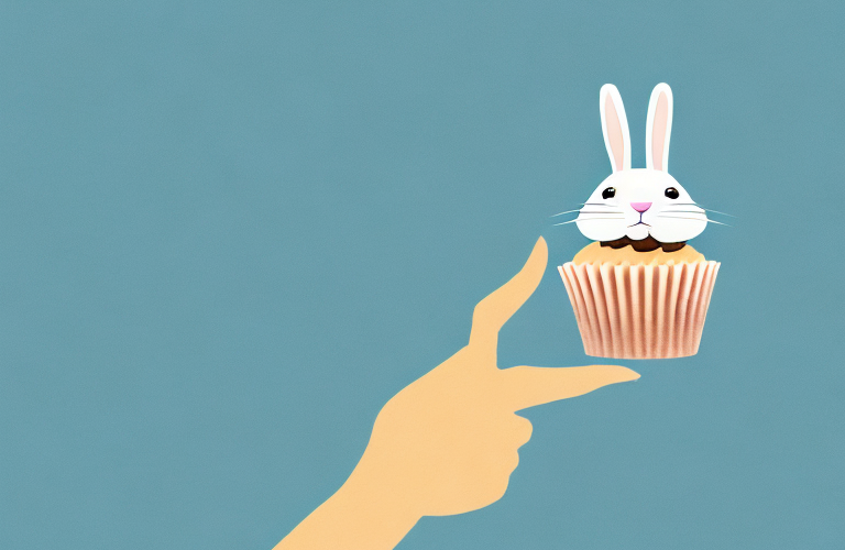 A rabbit holding a cupcake